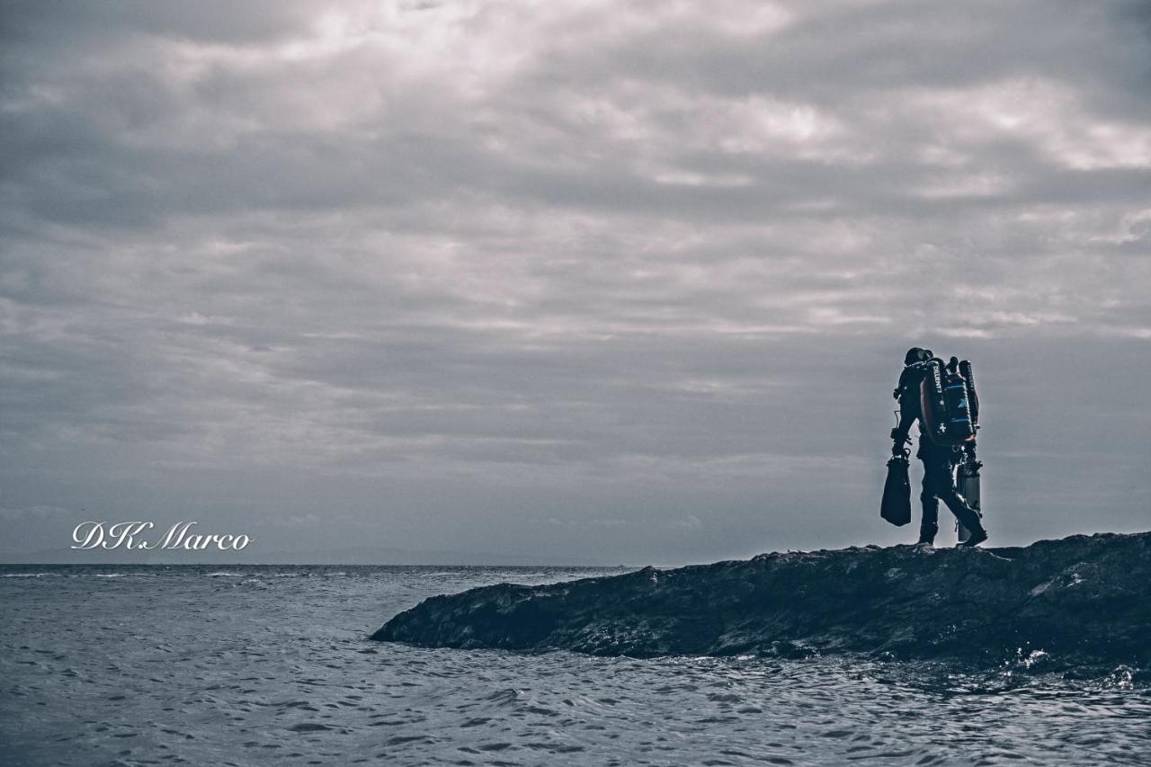 Sugarsea Inn & Dive Shop ماكتان المظهر الخارجي الصورة
