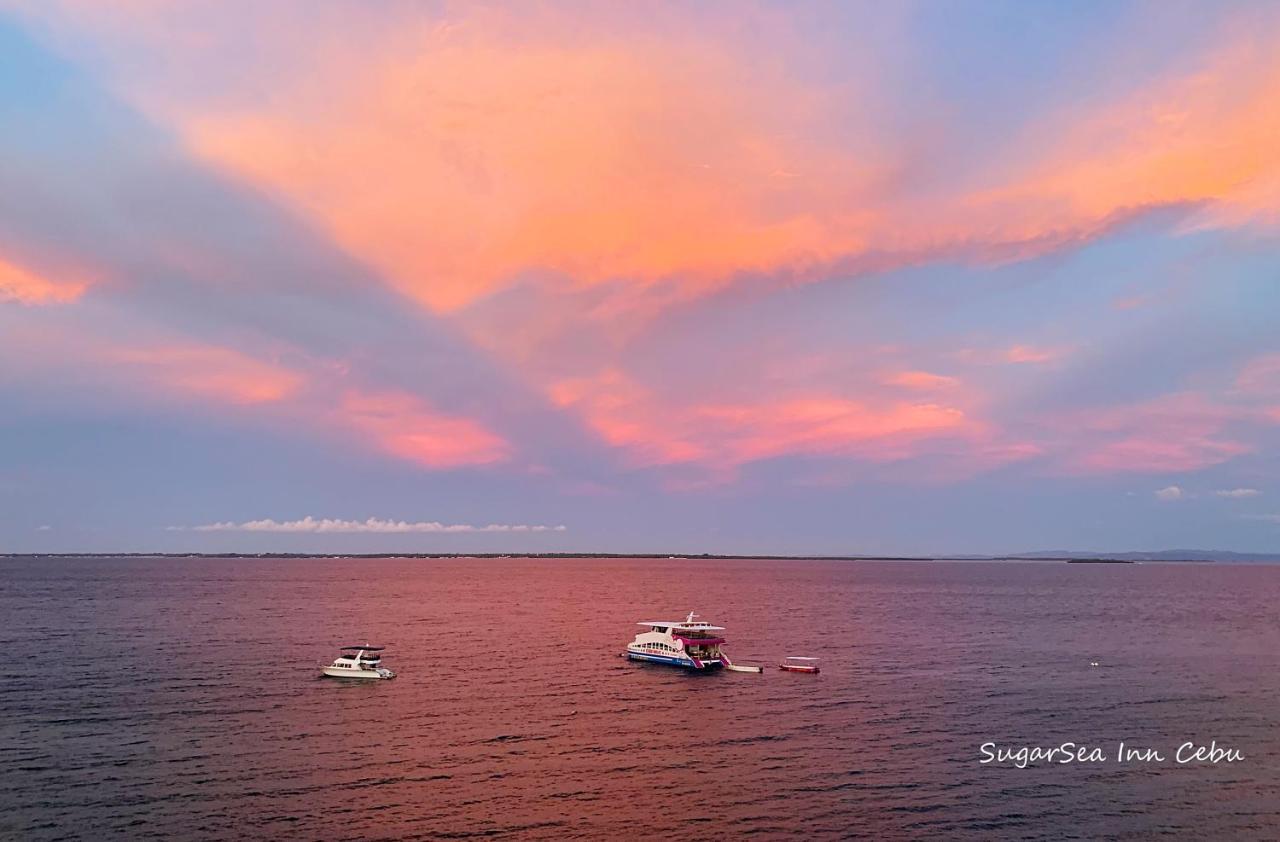 Sugarsea Inn & Dive Shop ماكتان المظهر الخارجي الصورة