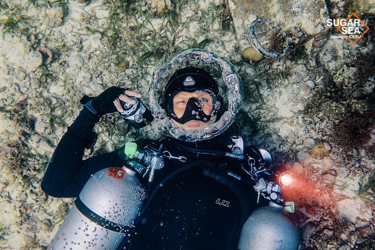 Sugarsea Inn & Dive Shop ماكتان المظهر الخارجي الصورة
